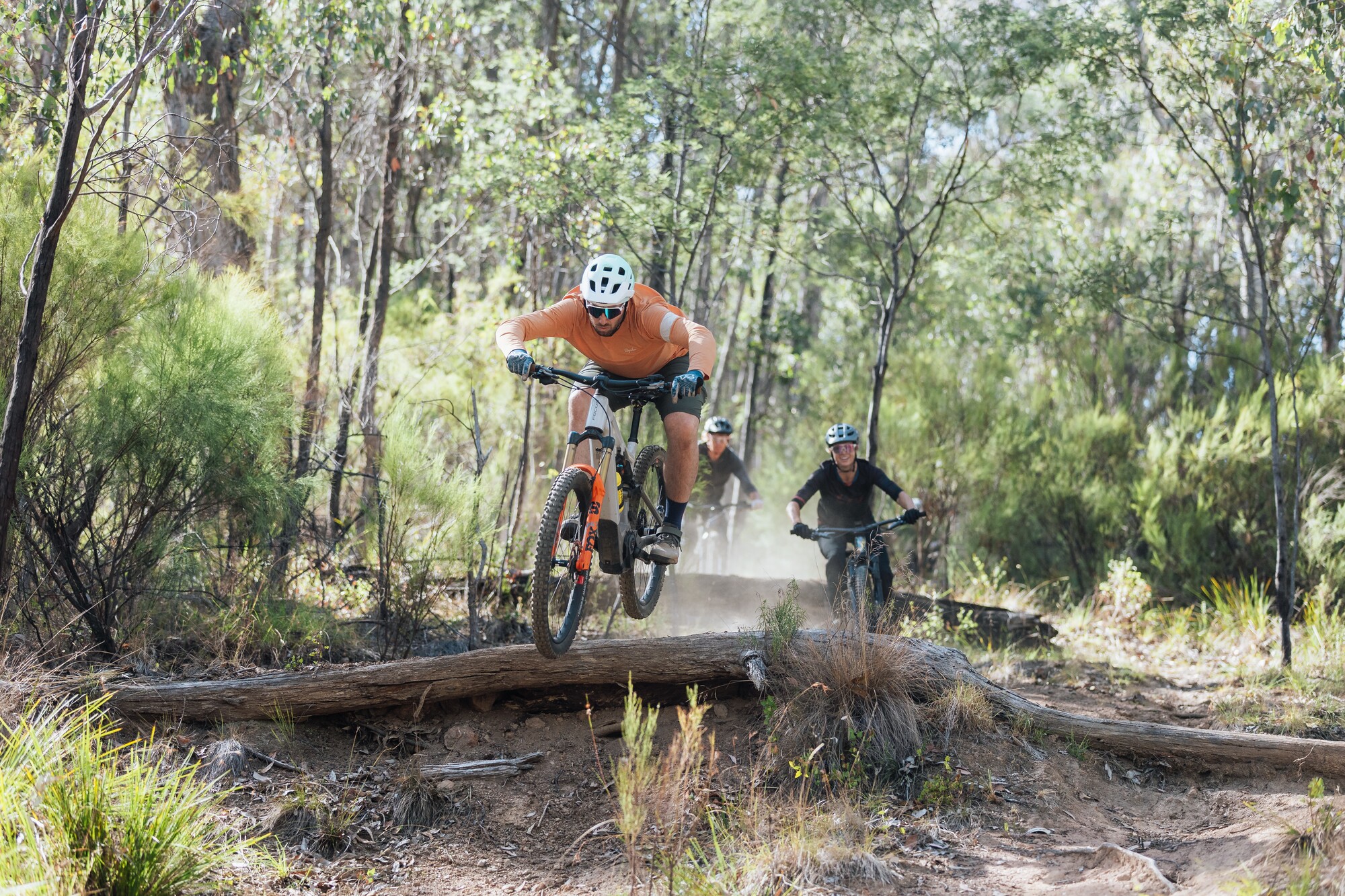 A group of riders taking on technical features at Big Hill Mountain Bike Park
