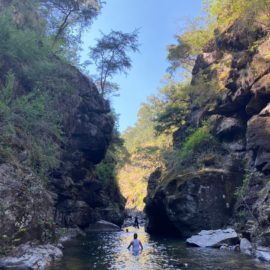 a person standing in a gorge